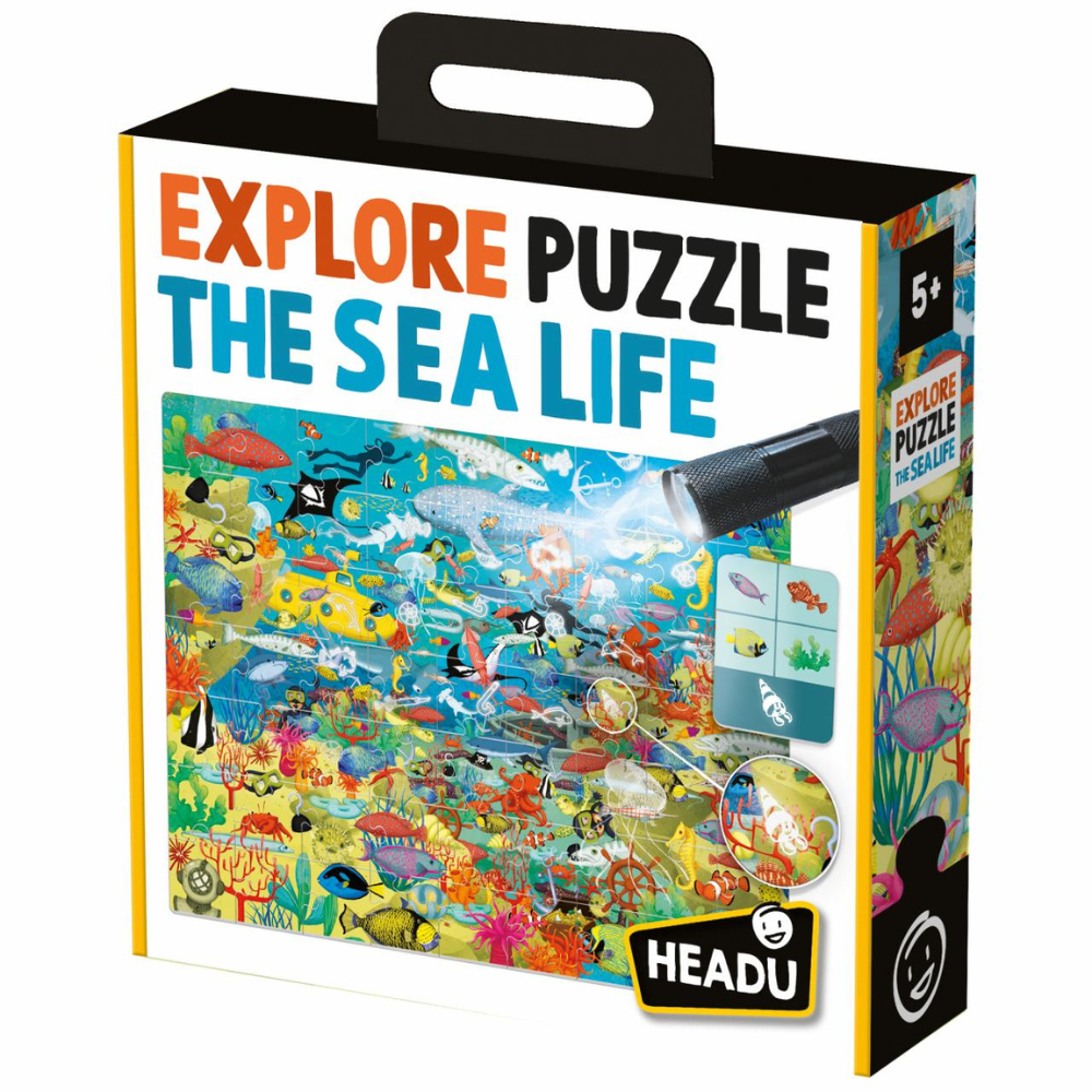 Enfant assemblant le puzzle Explore la Mer