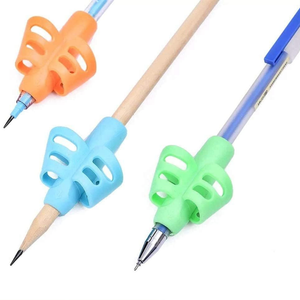 Guide doigt silicone orange pour apprentissage écriture