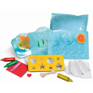 Vue d'ensemble du contenu du kit Ma fabrique à bougies : paraffine, moules, décoratifs et notice