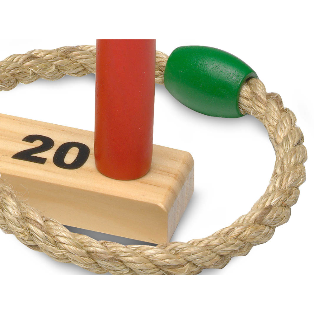 Enfants en pleine action avec le jeu Rings Stick en extérieur, renforçant la concentration